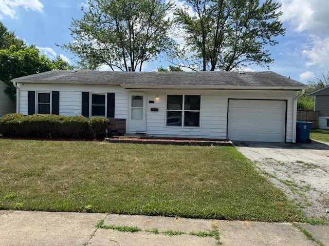a house with trees in the background