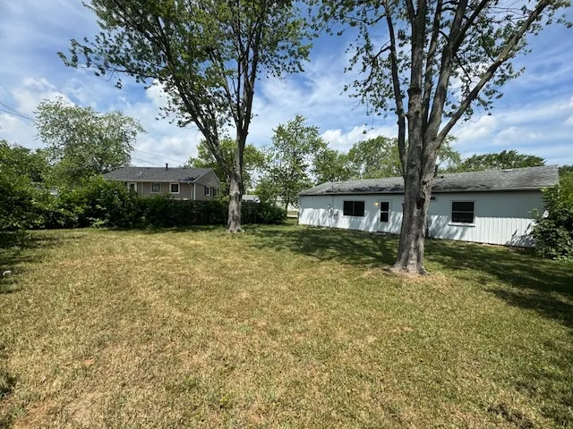 a house with trees in the background