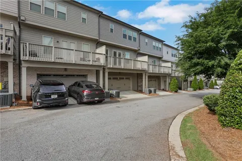 a view of a car park in front of house