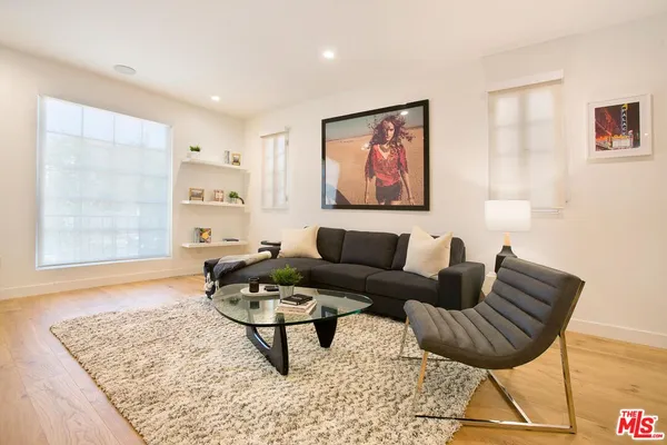 a living room with furniture and a rug