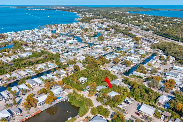an aerial view of residential building and ocean