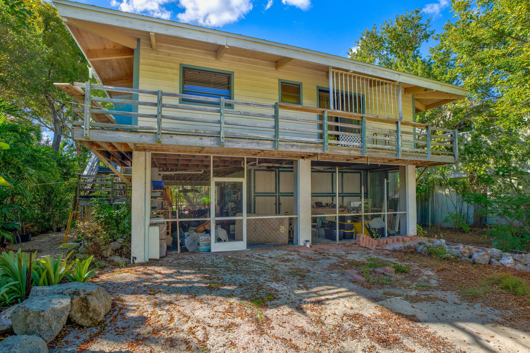 708 North Lake Drive Key Largo, FL 33037 - Photo 38 of 40 a front view of a house with a garden