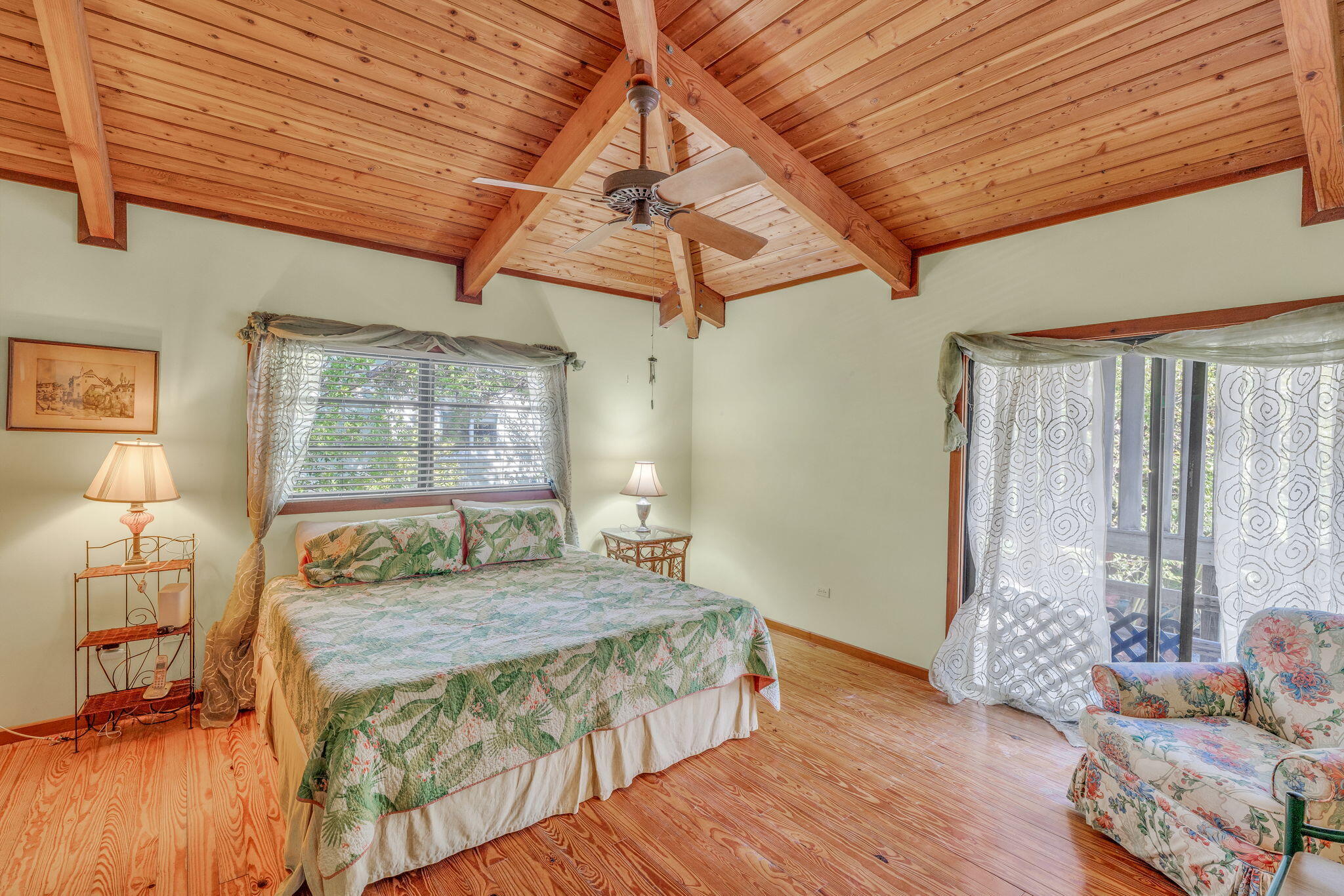 708 North Lake Drive Key Largo, FL 33037 - Photo 8 of 40 a bedroom with a bed and wooden floor