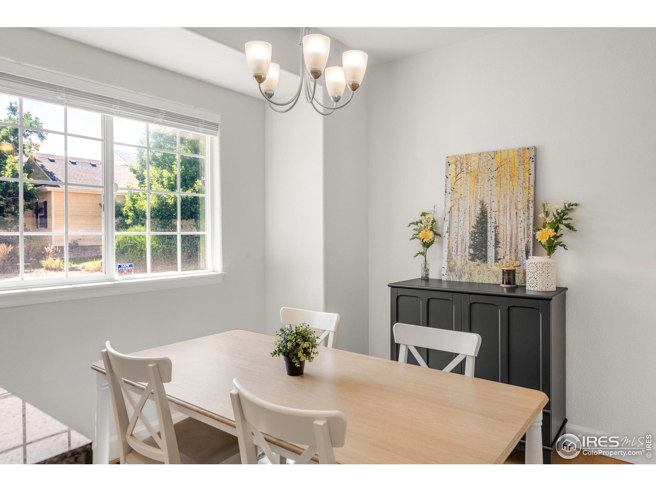 4232 Riley Drive Longmont, CO 80503 - Photo 16 of 35 a view of a dining room with furniture window and outside view