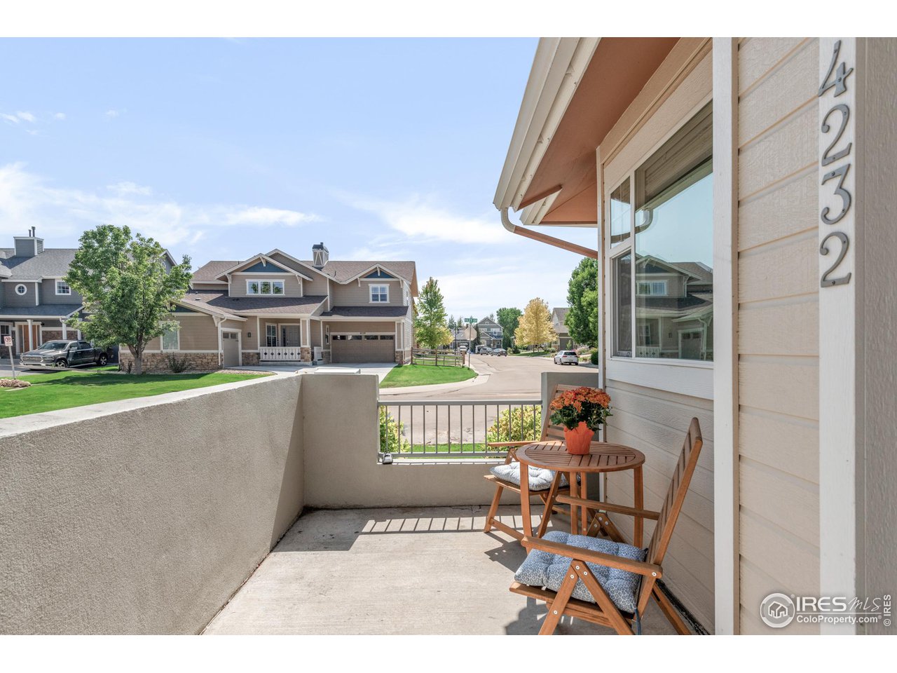 4232 Riley Drive Longmont, CO 80503 - Photo 2 of 35 a balcony with table and chairs
