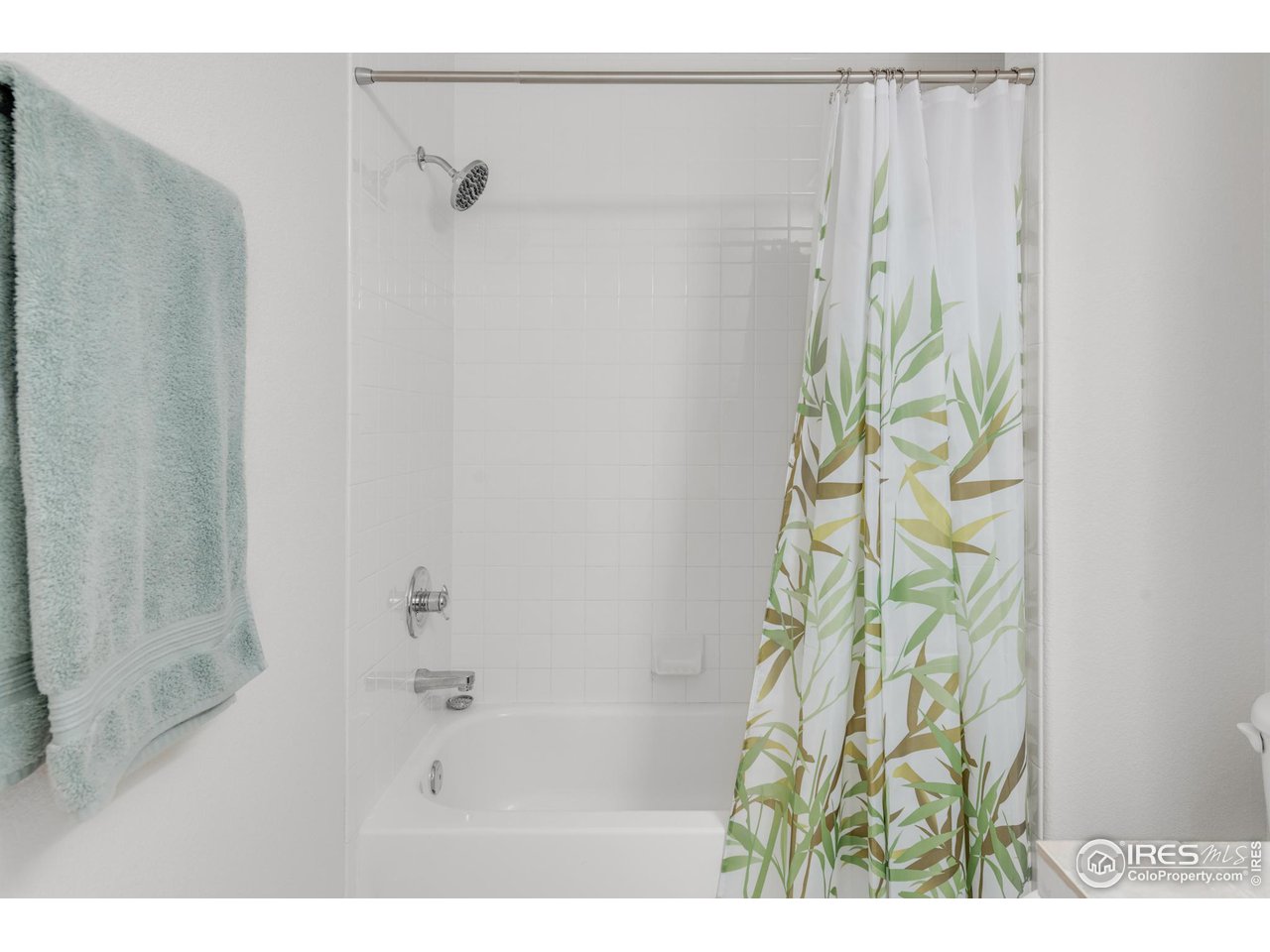 4232 Riley Drive Longmont, CO 80503 - Photo 29 of 35 a bathroom with a shower curtain and a window