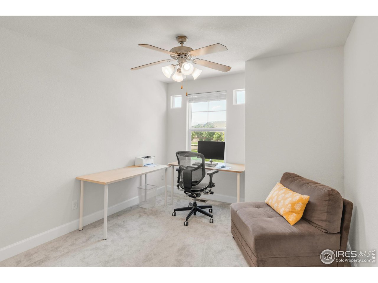 4232 Riley Drive Longmont, CO 80503 - Photo 30 of 35 a work room with furniture and a window