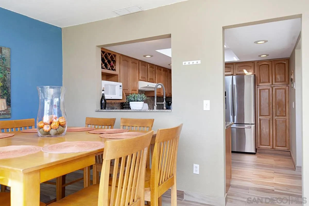 9433 Doheny Road Santee, CA 92071 - Photo 11 of 31 a kitchen with stainless steel appliances granite countertop a sink and a refrigerator