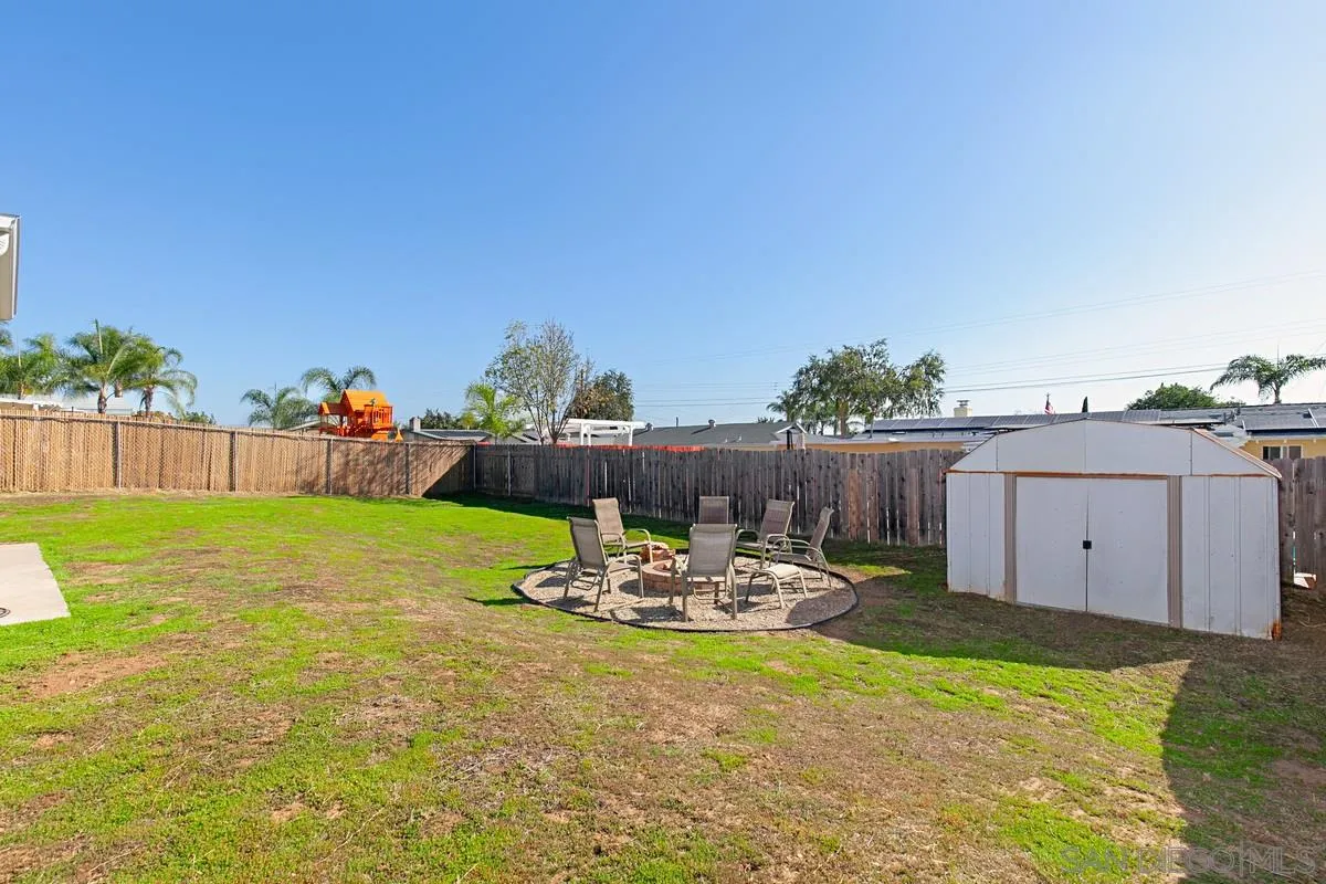 9433 Doheny Road Santee, CA 92071 - Photo 30 of 31 a backyard of a house with table and chairs