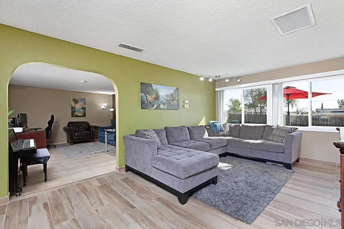 9433 Doheny Road Santee, CA 92071 - Photo 3 of 31 a living room with furniture and a large window
