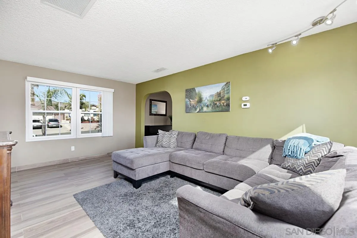 9433 Doheny Road Santee, CA 92071 - Photo 8 of 31 a living room with furniture and a window