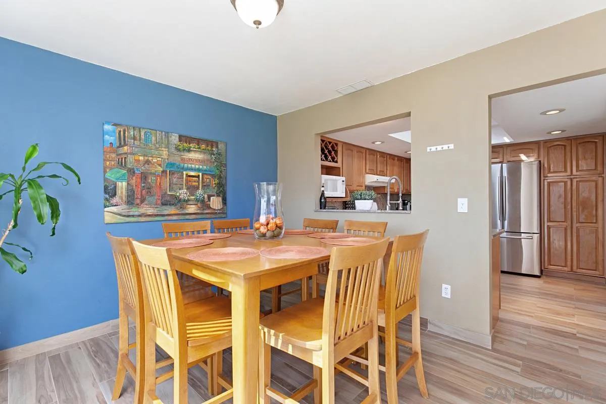 9433 Doheny Road Santee, CA 92071 - Photo 10 of 31 a view of a dining room with furniture and wooden floor