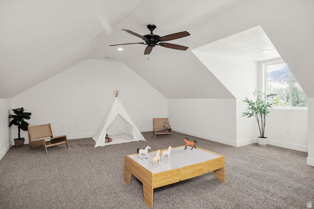 1552 Sumac Drive Logan, UT 84321 - Photo 29 of 72 Spacious attic room featuring sloped ceilings, recessed lighting, a ceiling fan, and gray carpet flooring