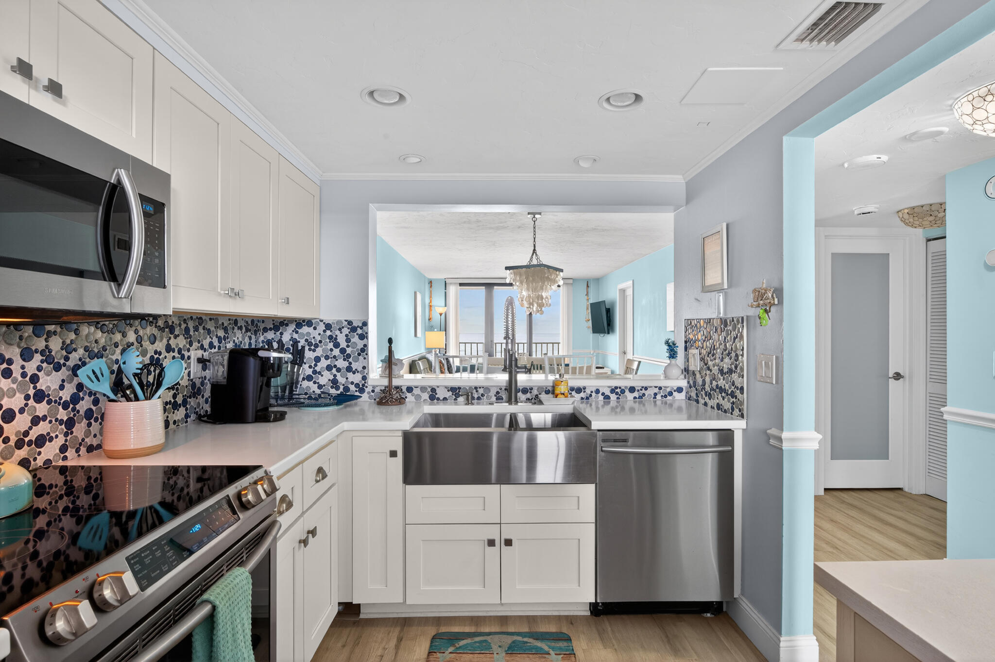 4250 North Hwy A1A, Unit 1007 Fort Pierce, FL 34949 - Photo 15 of 24 a kitchen with a sink stove and cabinets