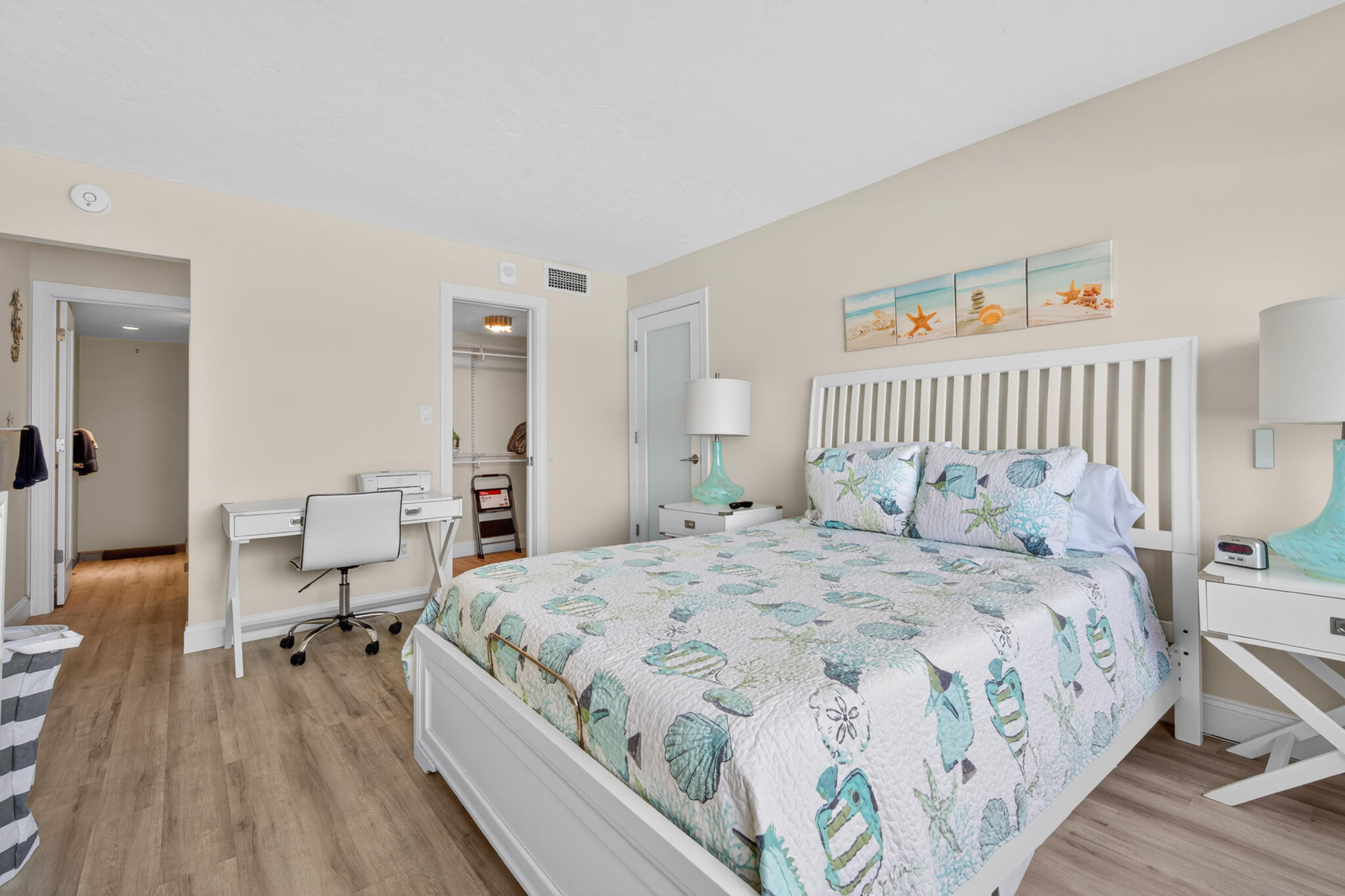 4250 North Hwy A1A, Unit 1007 Fort Pierce, FL 34949 - Photo 16 of 24 a bedroom with a large bed and a wooden floor