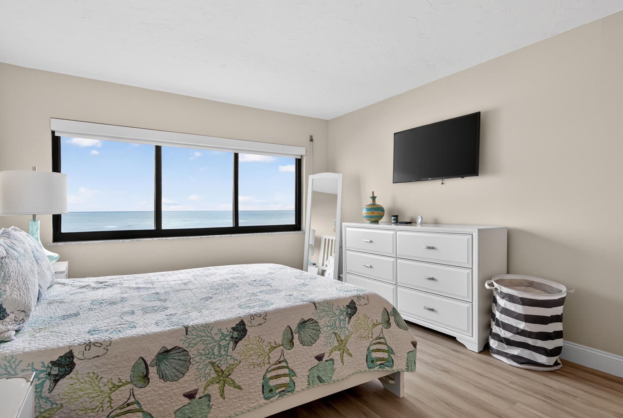 4250 North Hwy A1A, Unit 1007 Fort Pierce, FL 34949 - Photo 17 of 24 a bedroom with a bed and a flat screen tv