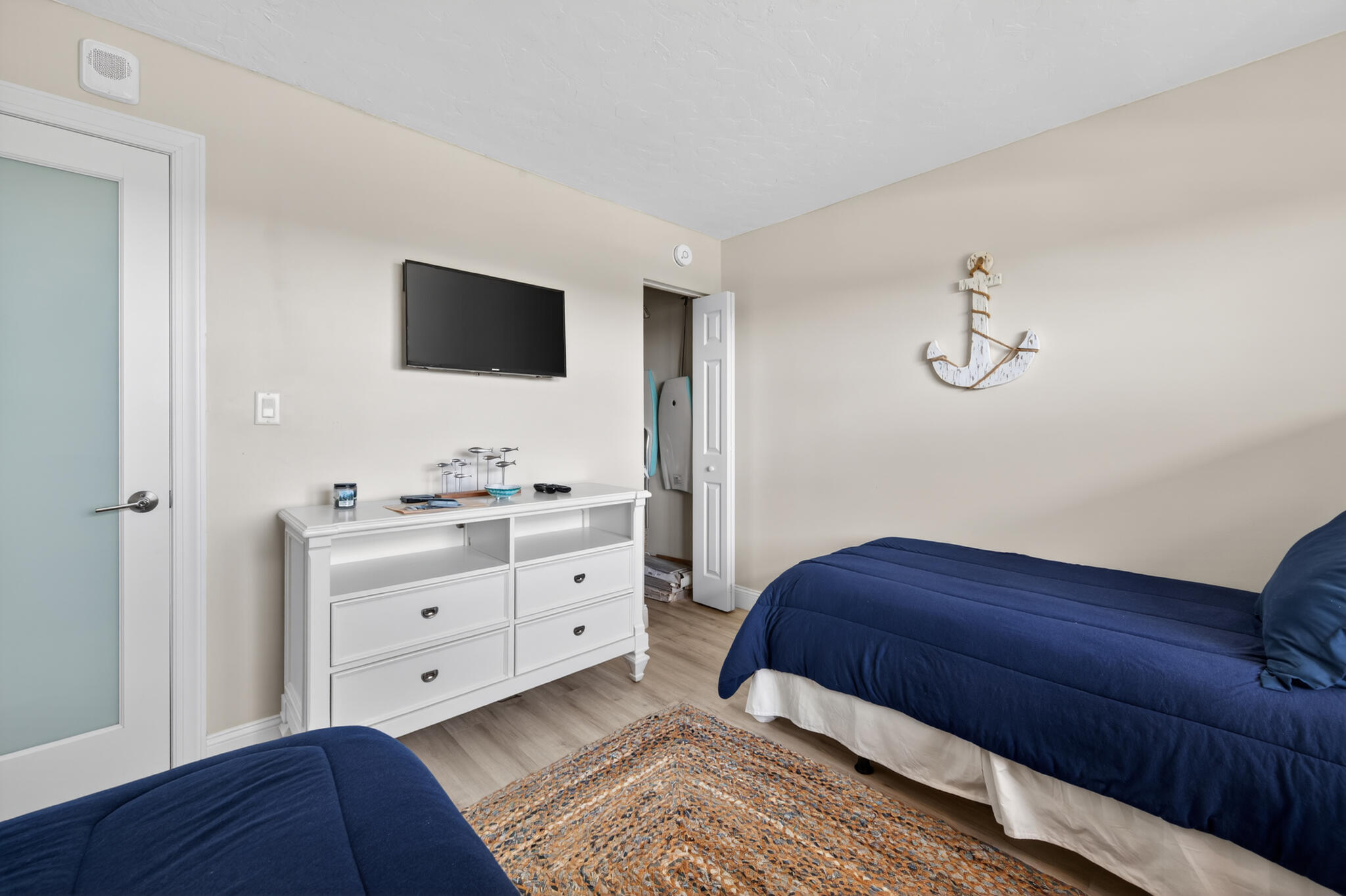 4250 North Hwy A1A, Unit 1007 Fort Pierce, FL 34949 - Photo 23 of 24 a bedroom with a bed and a dresser