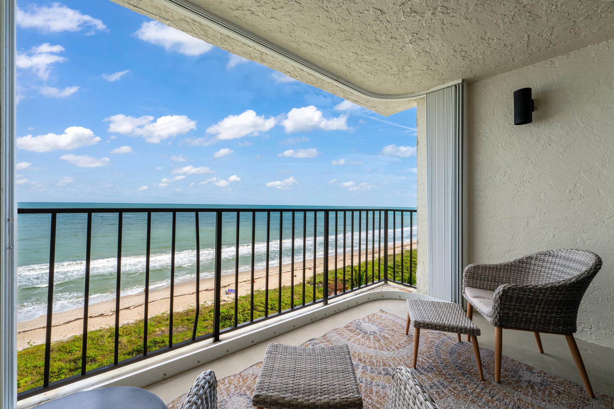 4250 North Hwy A1A, Unit 1007 Fort Pierce, FL 34949 - Photo 4 of 24 a balcony with table and chairs