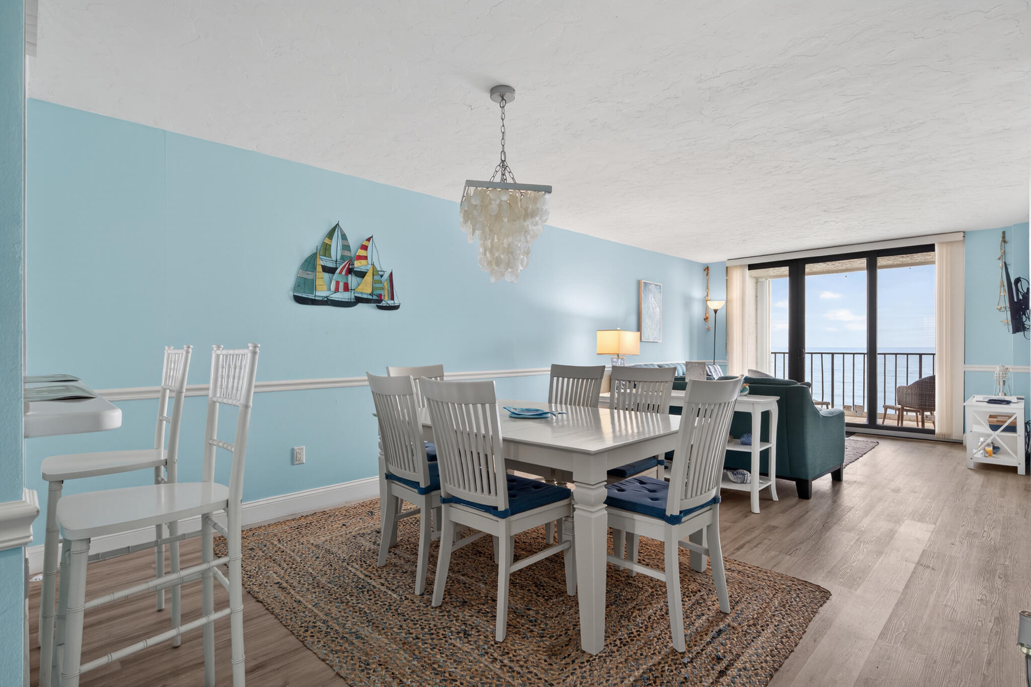 4250 North Hwy A1A, Unit 1007 Fort Pierce, FL 34949 - Photo 6 of 24 a view of a dining room with furniture window and wooden floor