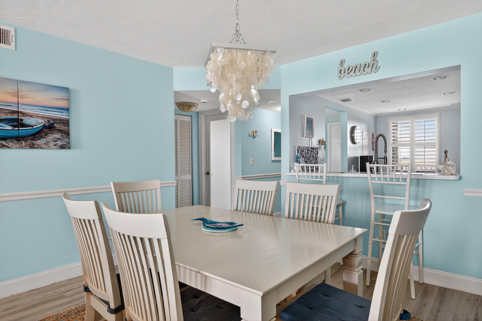 4250 North Hwy A1A, Unit 1007 Fort Pierce, FL 34949 - Photo 8 of 24 a view of a dining room with furniture and wooden floor