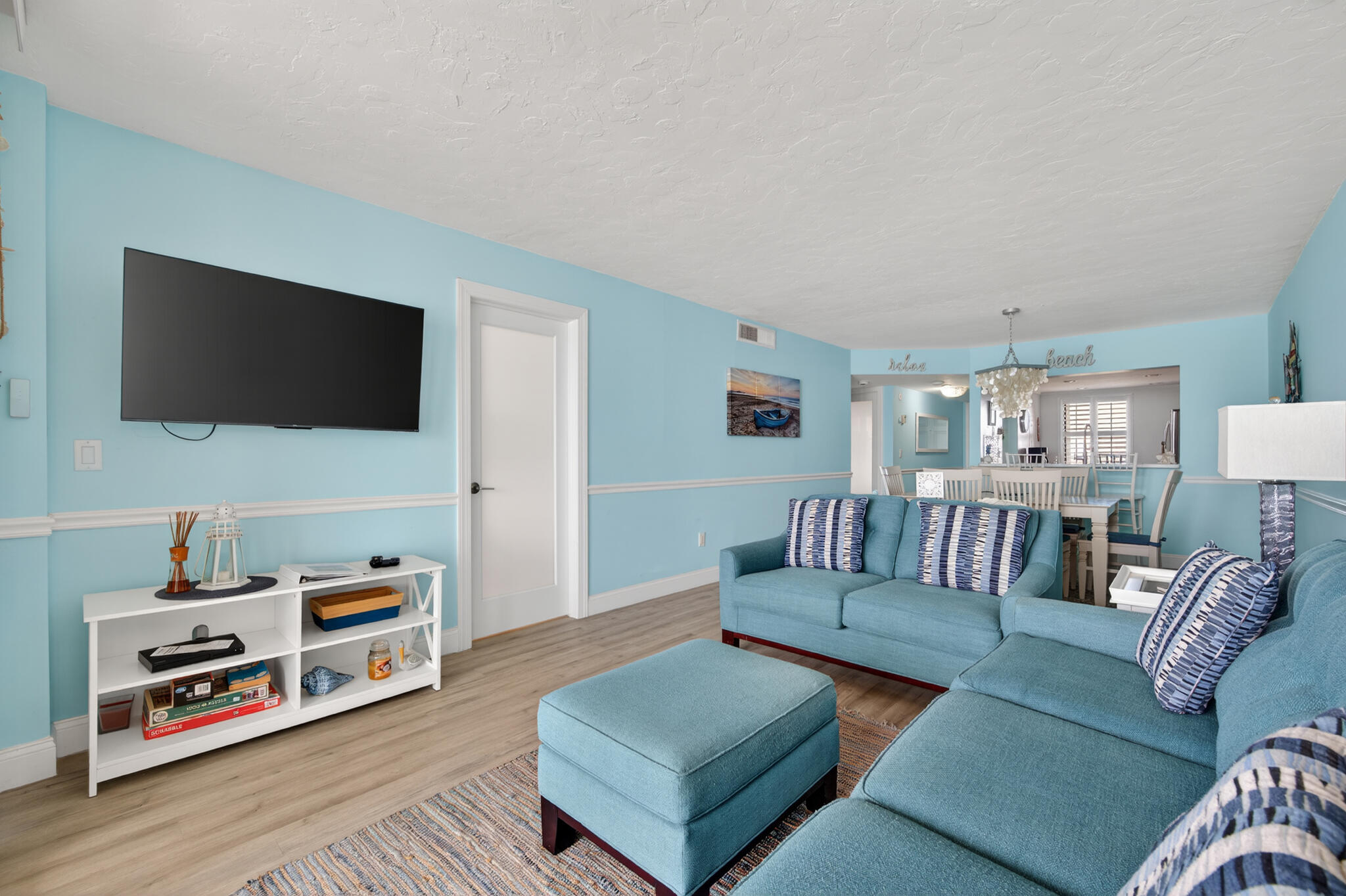 4250 North Hwy A1A, Unit 1007 Fort Pierce, FL 34949 - Photo 9 of 24 a living room with furniture and a flat screen tv