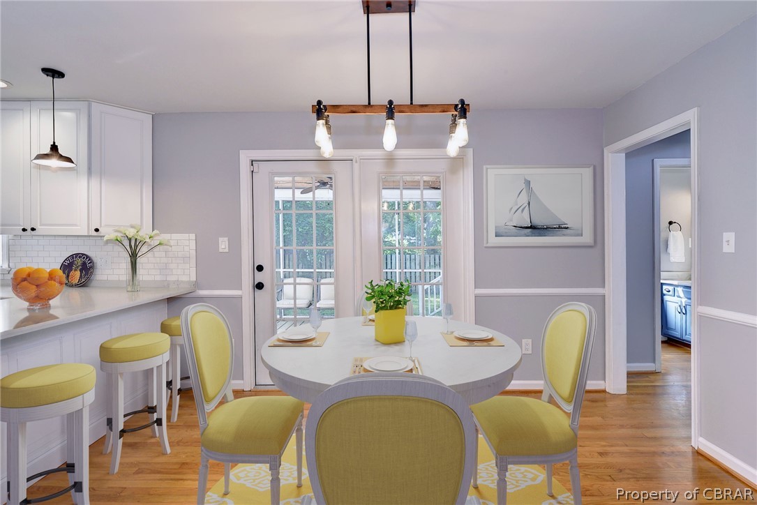 137 Wilderness Road Hampton, VA 23669 - Photo 10 of 45 137 Wilderness Road Hampton VA. The breakfast room looks out towards the screen porch through French doors. This photo has been virtually staged.