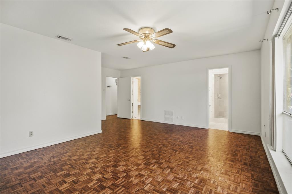 15721 Mapleview Circle Dallas, TX 75248 - Photo 23 of 40 a view of an empty room with wooden floor