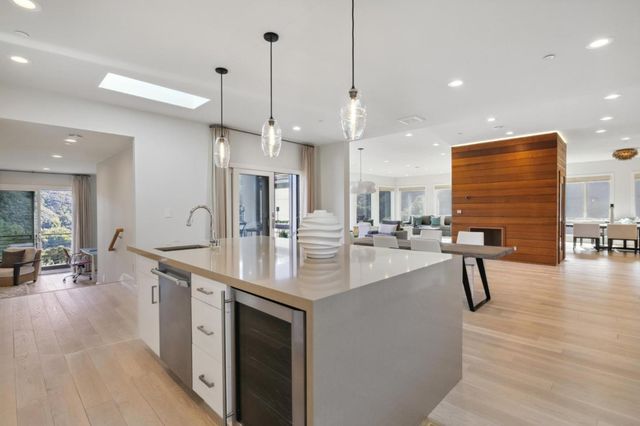 a kitchen with stainless steel appliances a stove microwave and cabinets