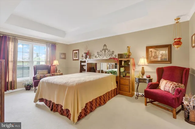 a bed room with a bed and chair