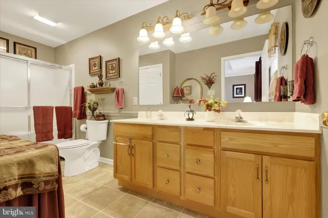 a bathroom with a sink double vanity and a mirror