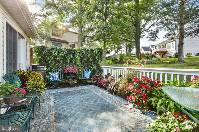 a view of a house with a yard and deck