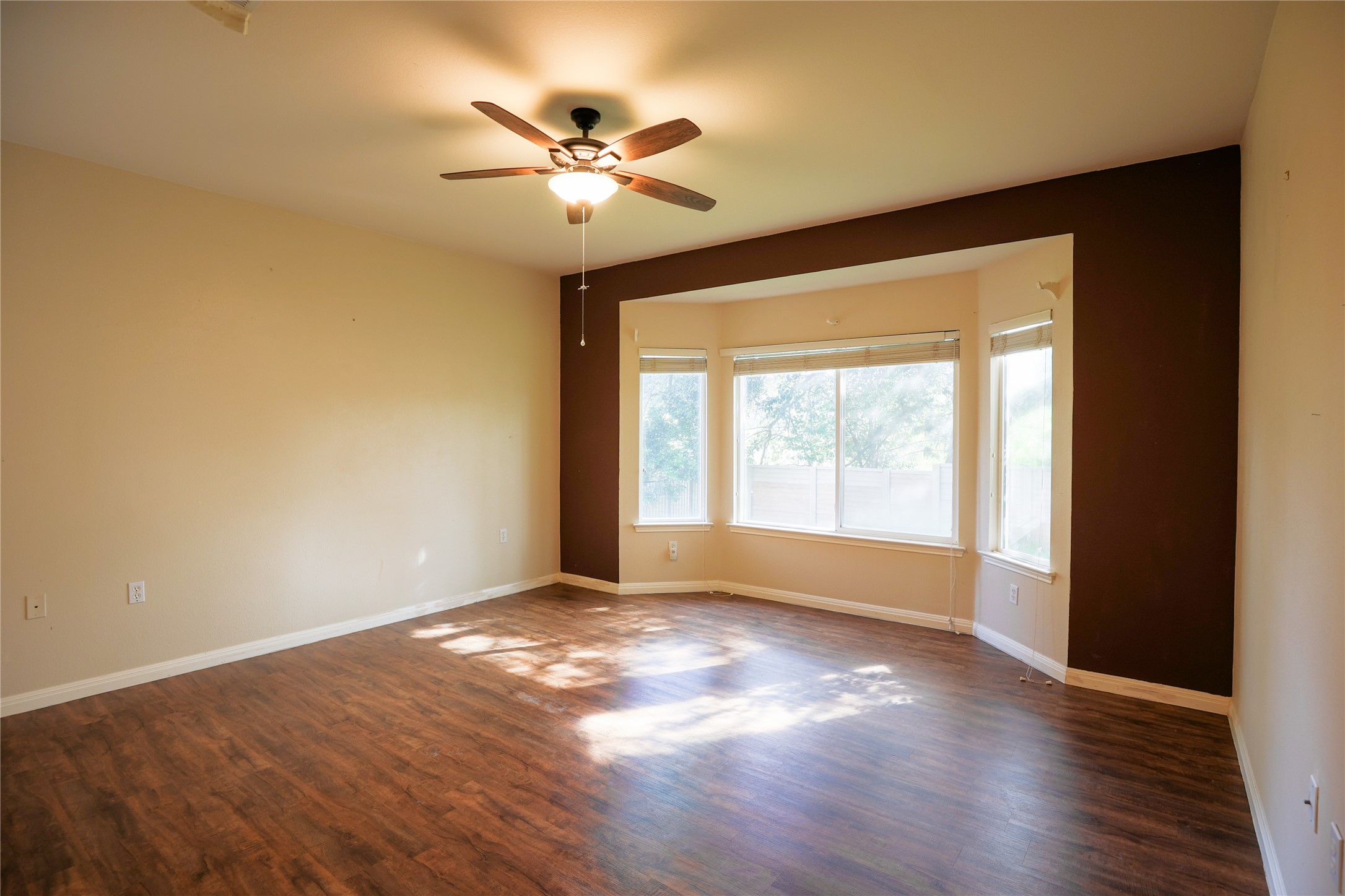225 Red Poppy Trail Georgetown, TX 78633 - Photo 14 of 15 Primary Bedroom with bay window. view of the backyard