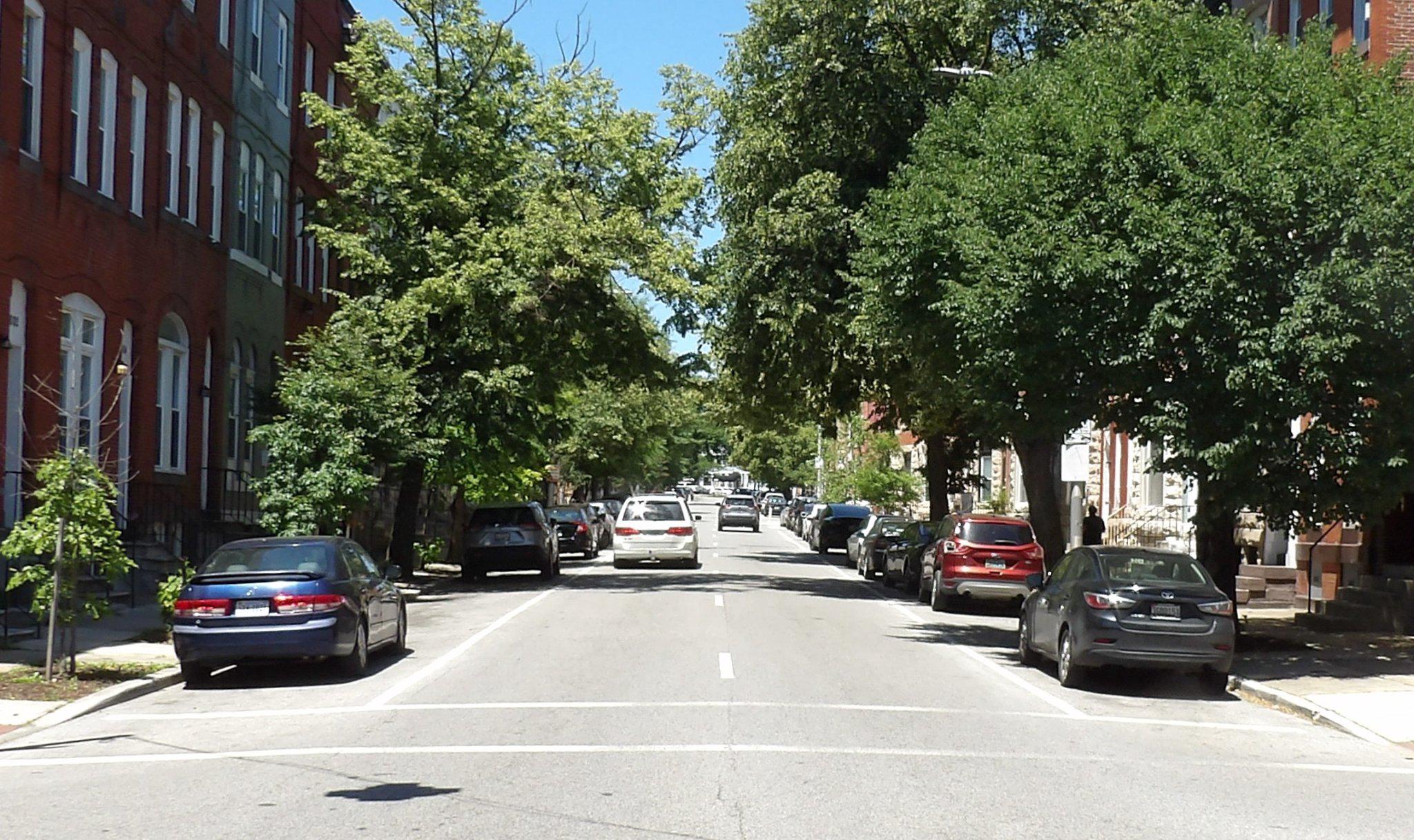 1932 McCulloh Street Baltimore, MD 21217 - Photo 3 of 11 a view of the street with parked cars