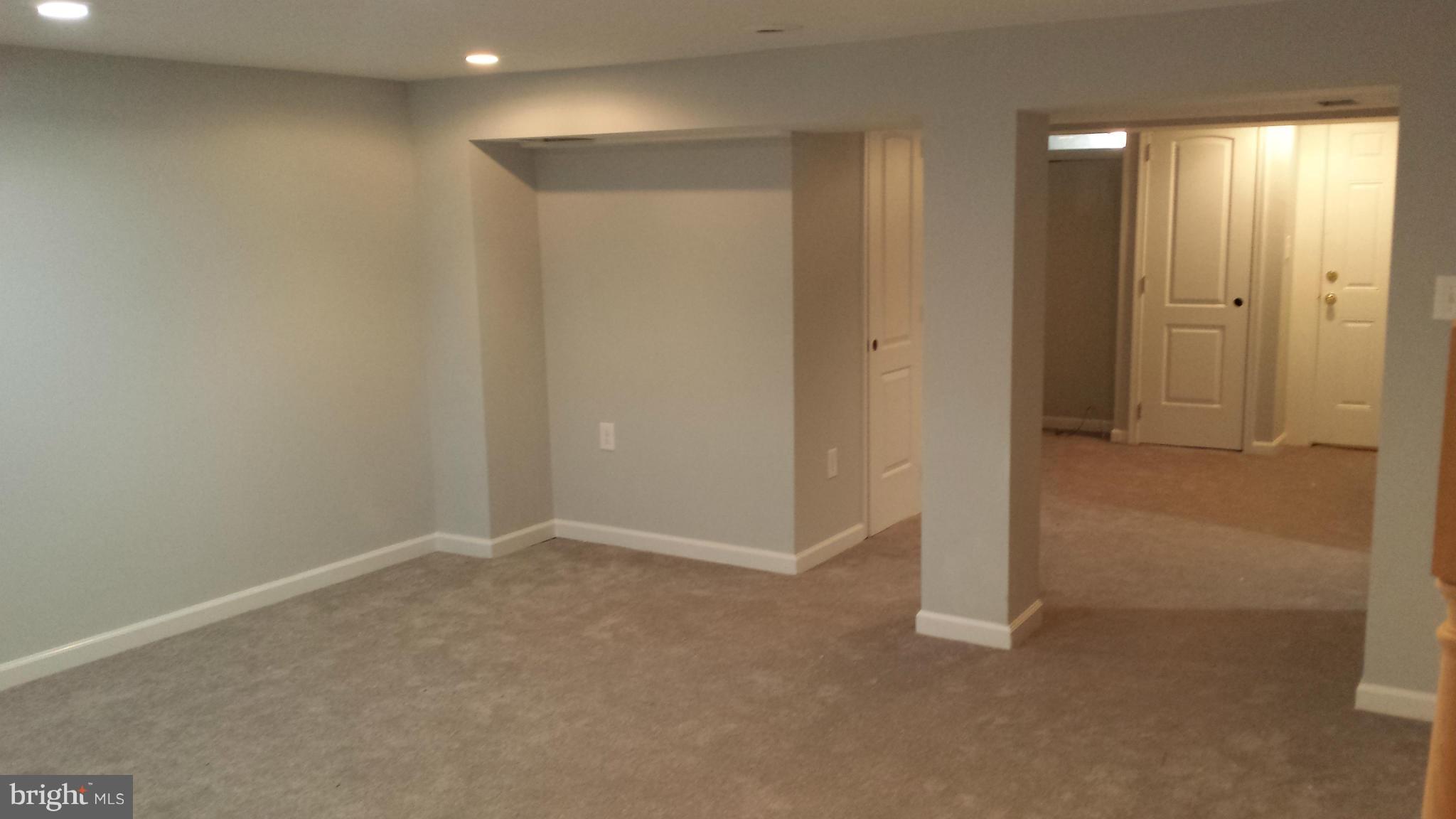 1111 Wicklow Road Baltimore, MD 21229 - Photo 12 of 15 an empty room with closet and mirror