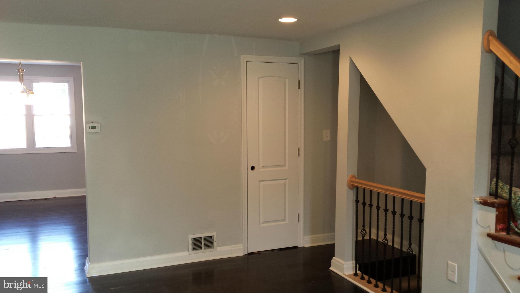 1111 Wicklow Road Baltimore, MD 21229 - Photo 3 of 15 a view of hallway with wooden floor and stairs