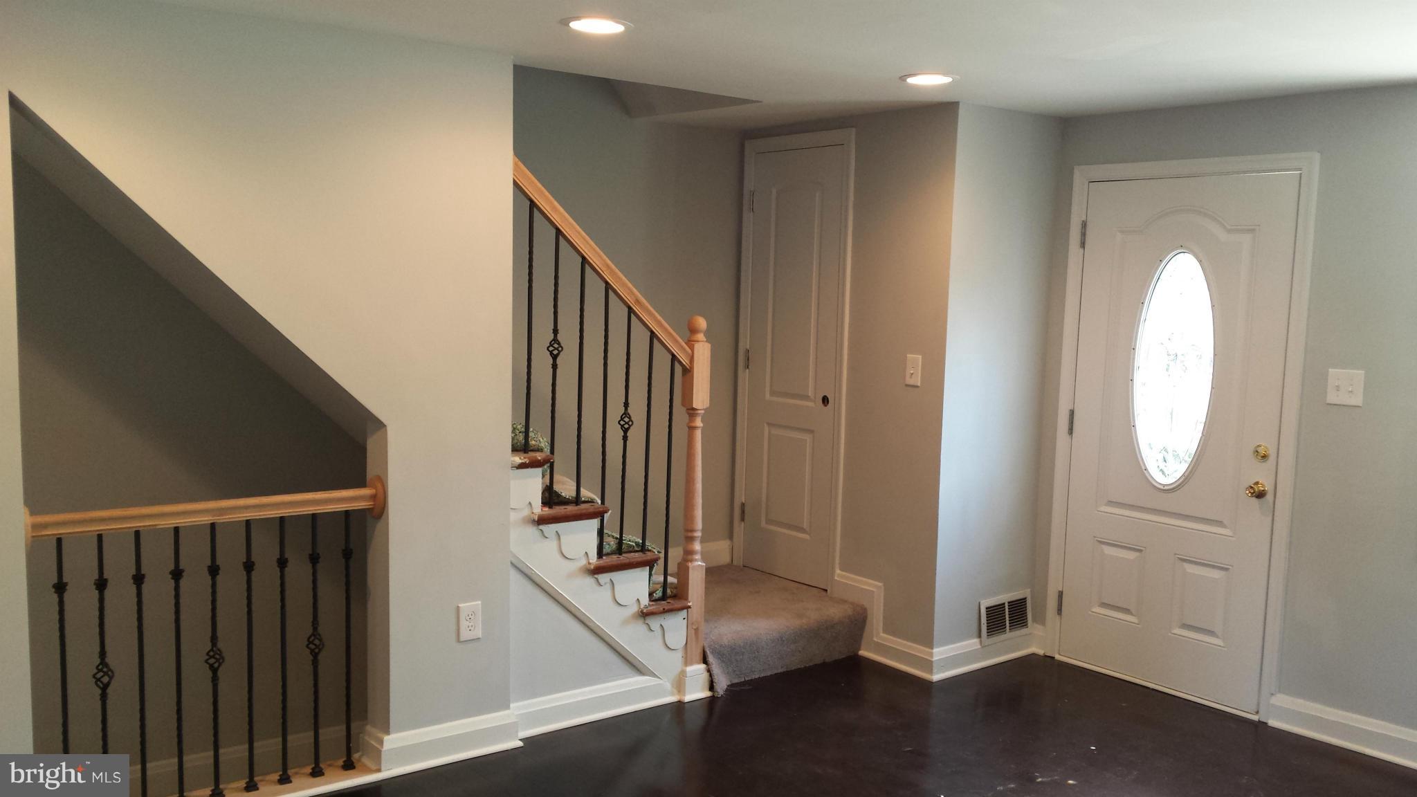 1111 Wicklow Road Baltimore, MD 21229 - Photo 4 of 15 a view of a hallway with entryway wooden floor and front door