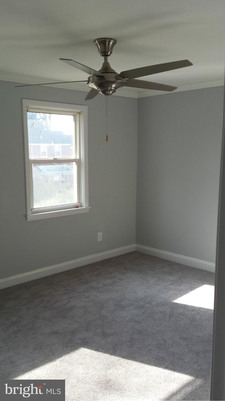 1111 Wicklow Road Baltimore, MD 21229 - Photo 7 of 15 a view of an empty room with a window