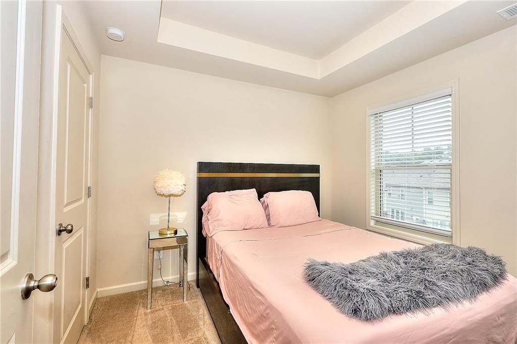 1306 Harris Way South Atlanta, GA 30319 - Photo 12 of 19 a bedroom with a bed and a window
