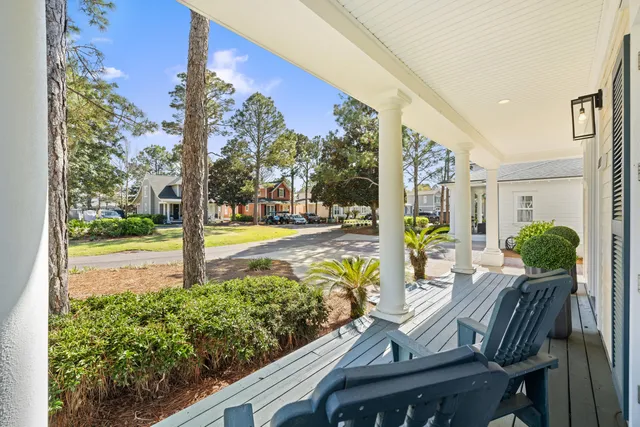 a view of a swimming pool with outdoor seating