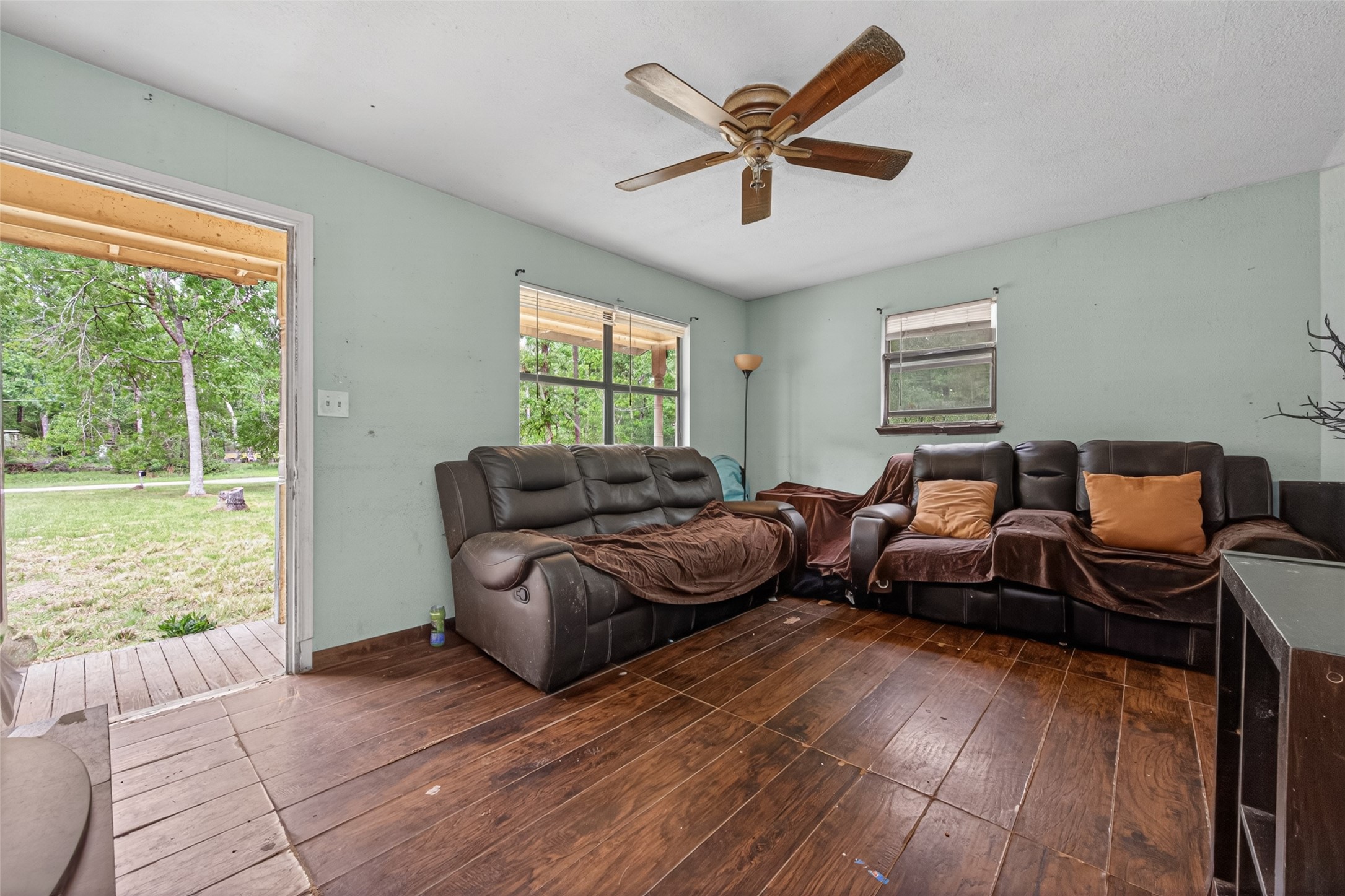 156 County Road 3709B Splendora, TX 77372 - Photo 10 of 29 a living room with furniture and a large window