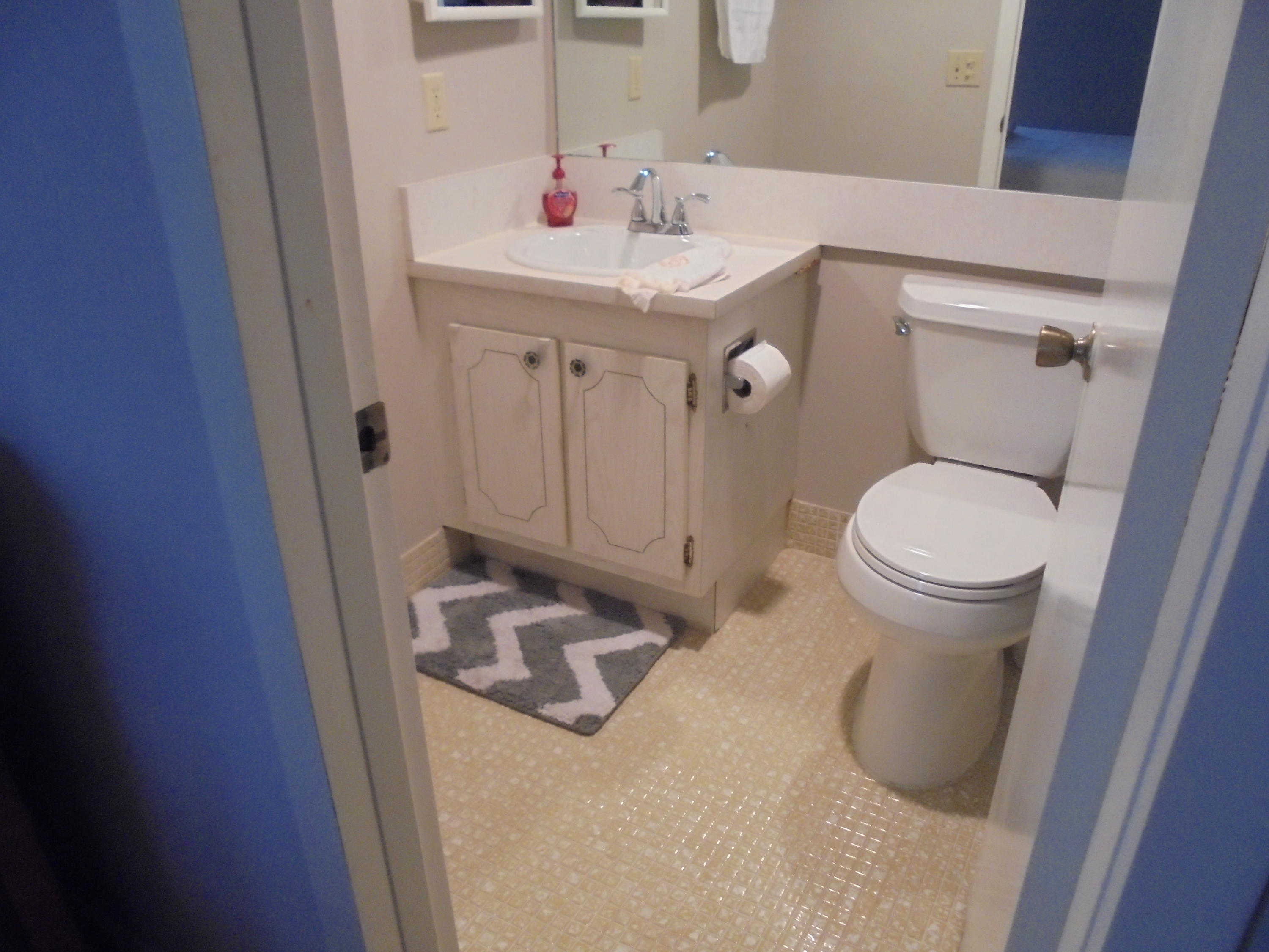 3 Dorset A Boca Raton, FL 33434 - Photo 14 of 18 a bathroom with a sink and a toilet