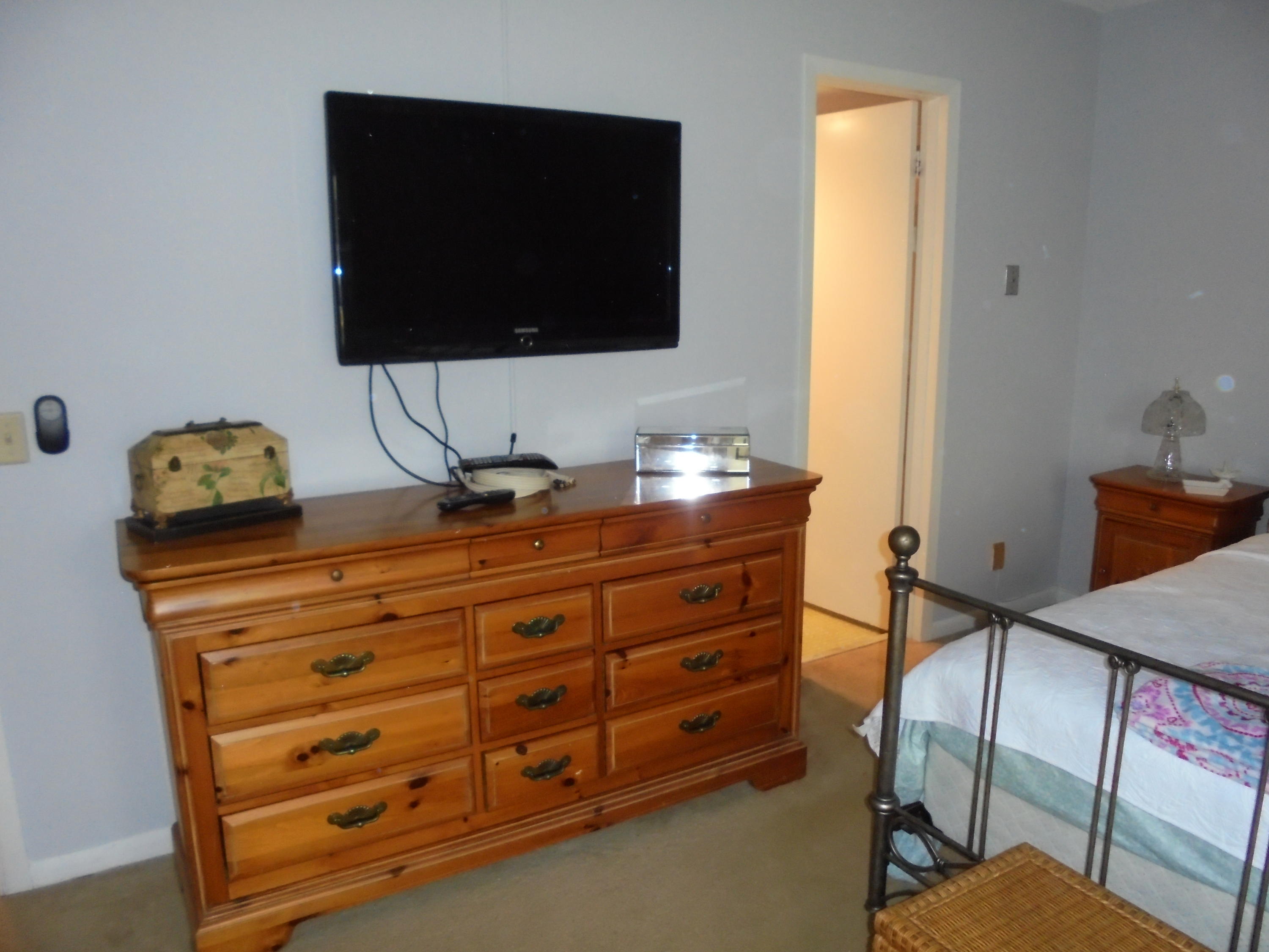 3 Dorset A Boca Raton, FL 33434 - Photo 16 of 18 a room with a bed and a television
