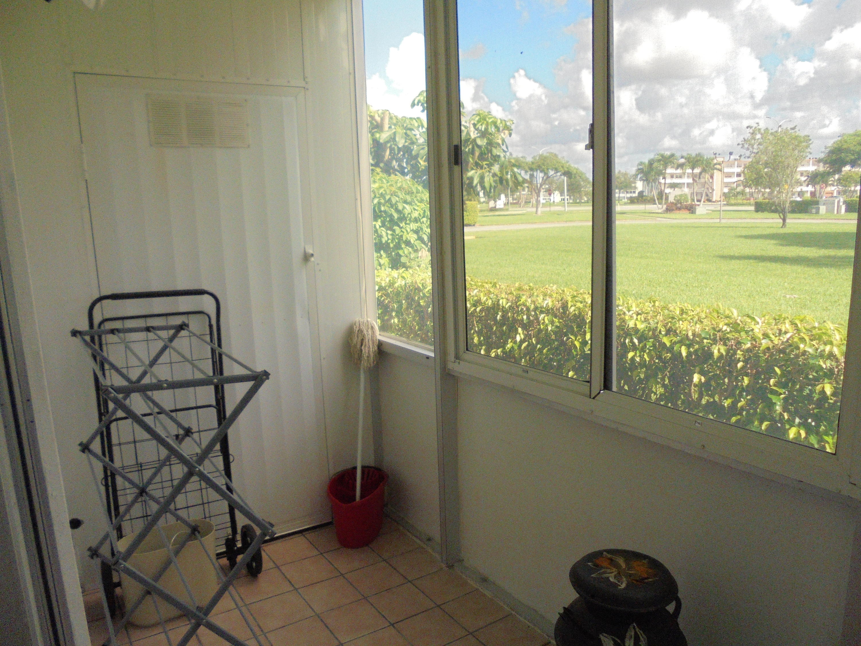 3 Dorset A Boca Raton, FL 33434 - Photo 17 of 18 a view of a balcony with chair and table