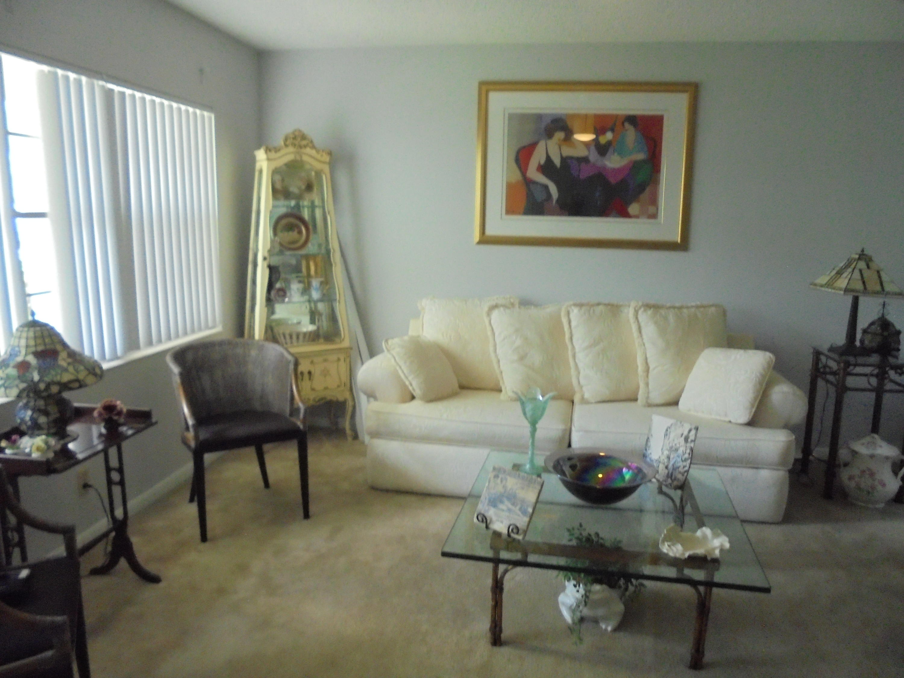 3 Dorset A Boca Raton, FL 33434 - Photo 3 of 18 a living room with furniture and a large window
