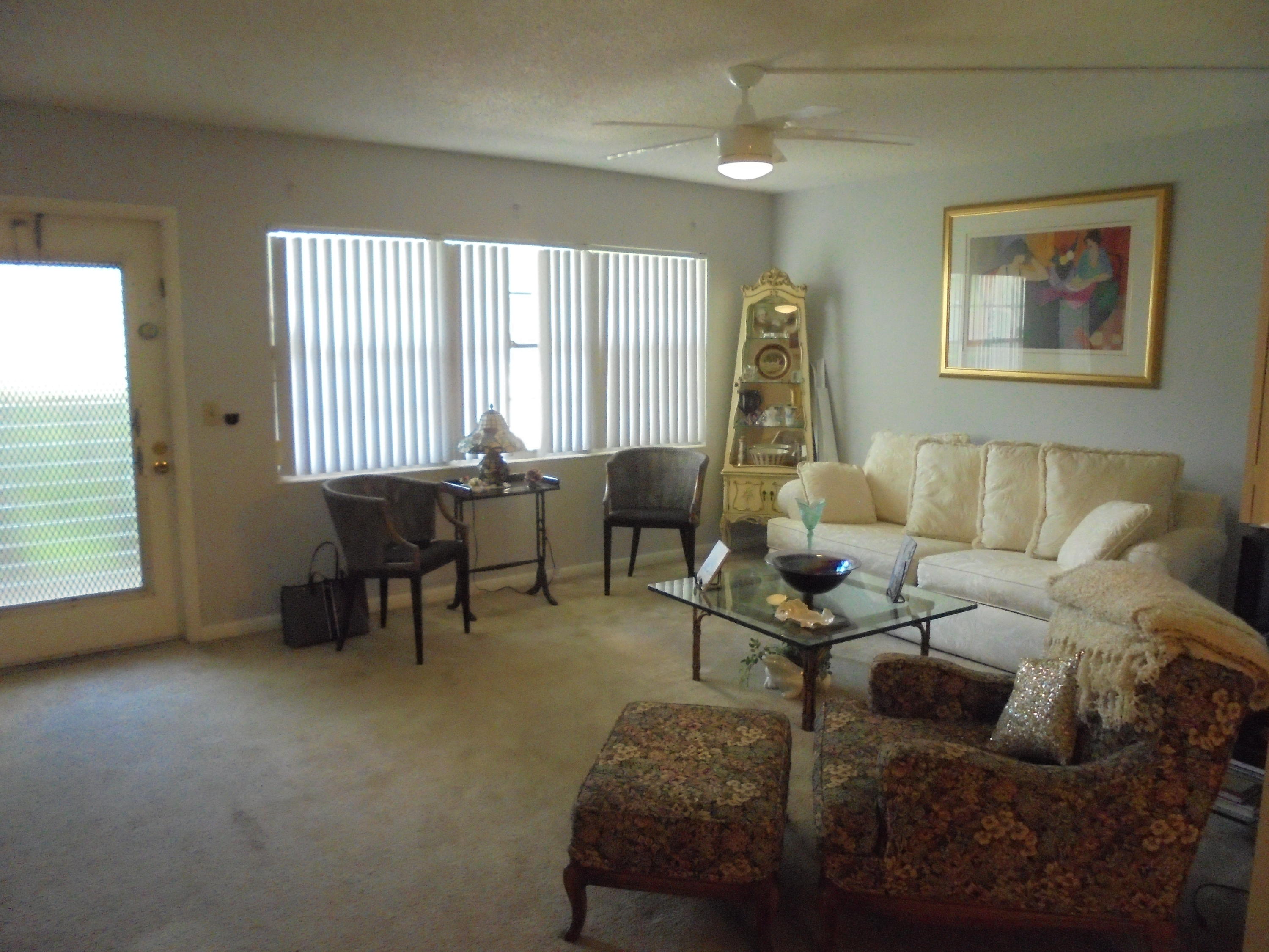 3 Dorset A Boca Raton, FL 33434 - Photo 4 of 18 a living room with furniture and a window