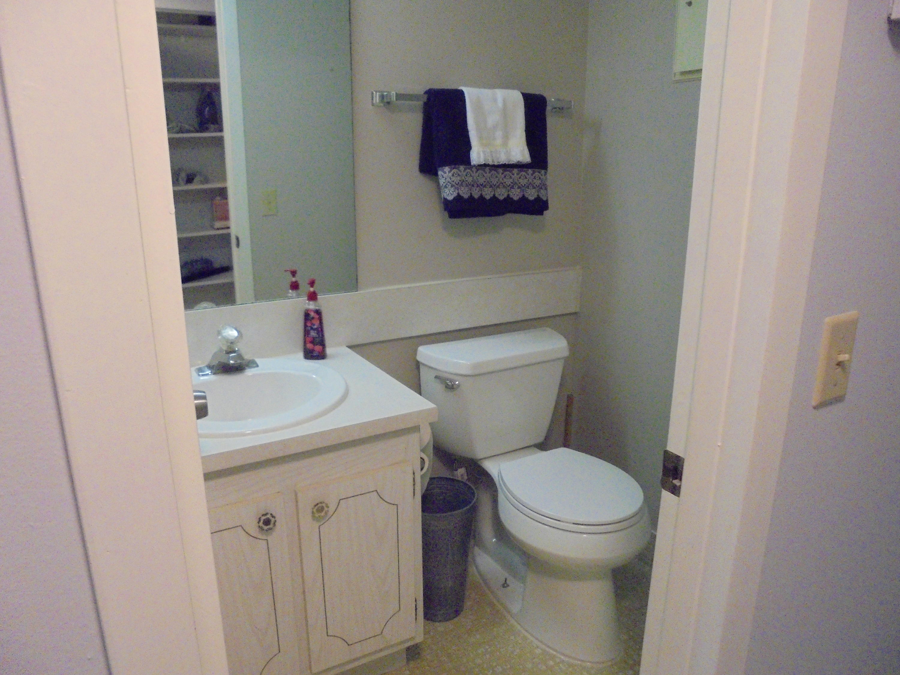 3 Dorset A Boca Raton, FL 33434 - Photo 10 of 18 a bathroom with a sink a toilet and mirror