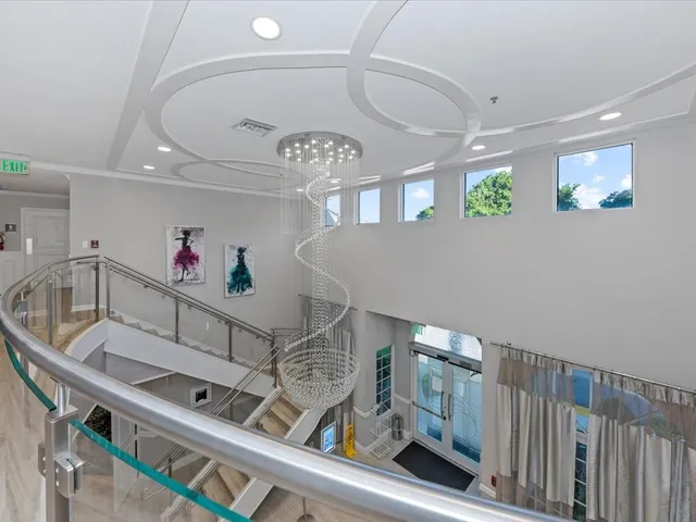 a living room with furniture and a book shelf