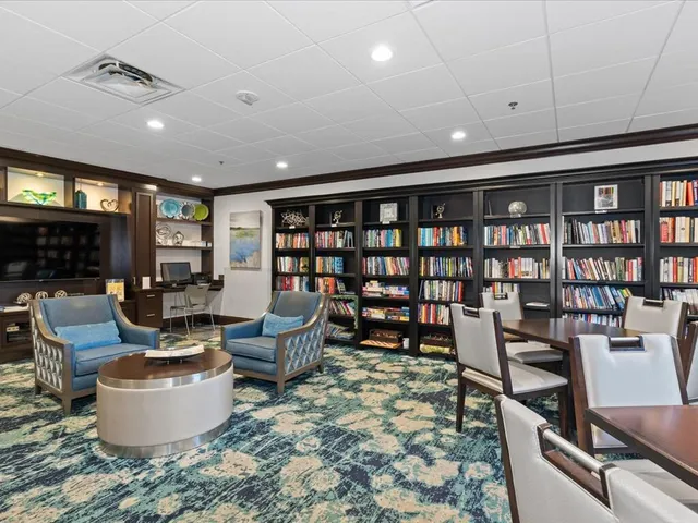 a view of a patio with table and chairs and potted plants