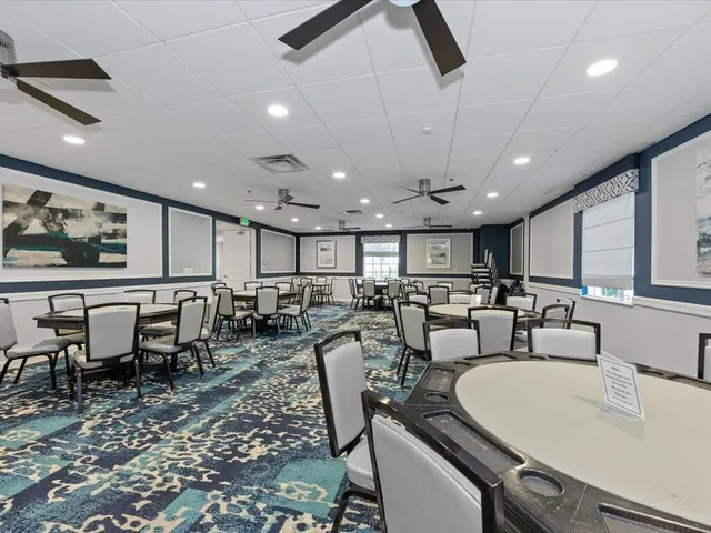 a view of a swimming pool with a patio and a garden