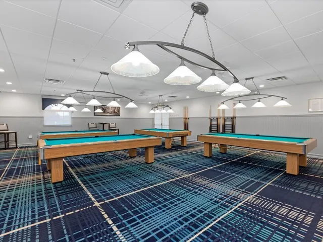 a room with lots of tables and chairs